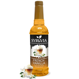 A bottle of Syruvia French Vanilla Coffee Syrup with real cane sugar, gluten-free, features a label with a coffee drink and vanilla flowers plus extra vanilla flowers at the base.