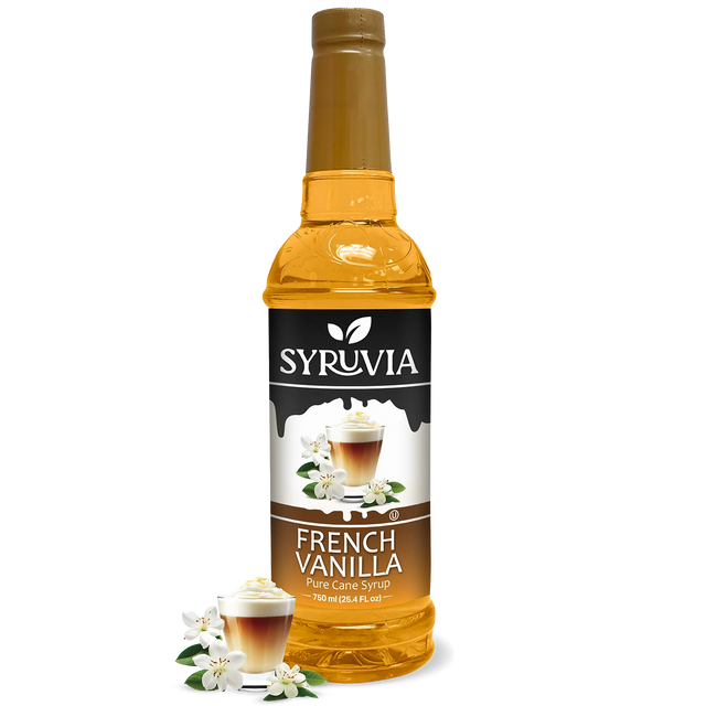A bottle of Syruvia French Vanilla Coffee Syrup with real cane sugar, gluten-free, features a label with a coffee drink and vanilla flowers plus extra vanilla flowers at the base.