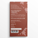 Back of chocolate bar wrapper with leaf pattern, ingredient list, guiding principles section, contact details, and allergen warnings for almonds and milk.