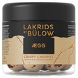 A 125g jar of Lakrids by Bulow Crispy Caramel features Danish chocolate-coated licorice with a crunchy core, presented in a clear container with a stylish black and gold label.