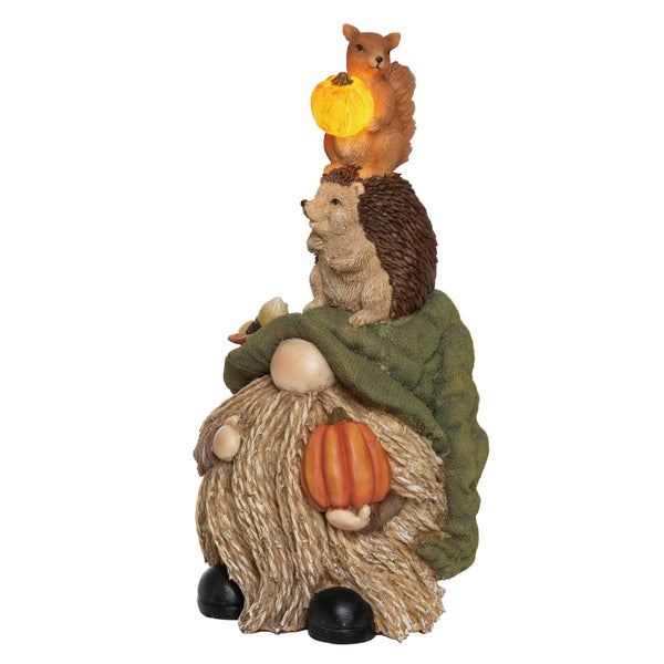 The 11 Light Up Braided Beard Woodland Gnome Friends Decor features a pumpkin-holding gnome, a hedgehog on its hat, and a squirrel with a glowing acorn.