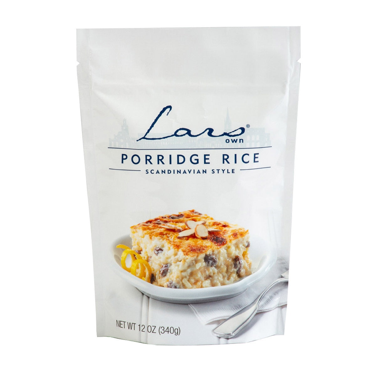 Product: Food - Lars Own Scandinavian Style Porridge Rice, 12 oz. The packaging features a tempting image of creamy rice pudding on a plate, making it an ideal choice for creating a comforting treat during the Christmas season and inviting you to enjoy this delightful culinary tradition.