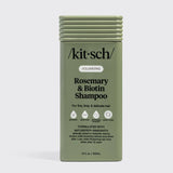 Olive green bottle of Kitsch Hair: Volumizing Rosemary & Biotin Shampoo 12oz for fine, limp, and delicate hair, featuring nourishing biotin and rosemary with certification icons and product details on the front label.