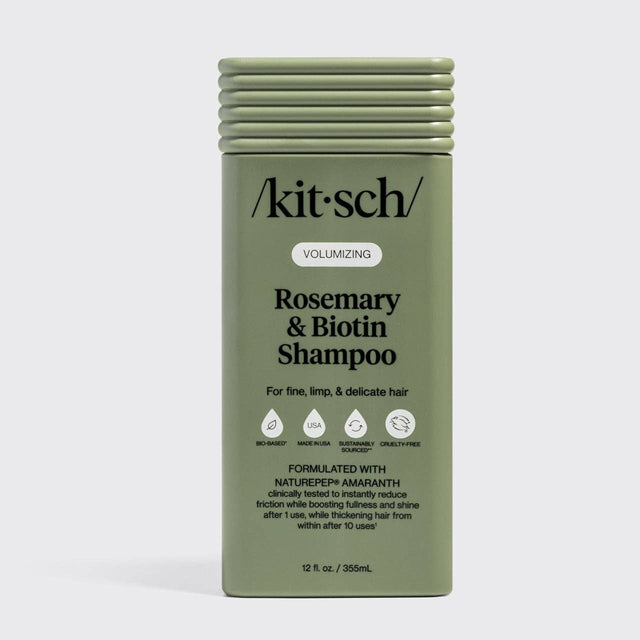 Olive green bottle of Kitsch Hair: Volumizing Rosemary & Biotin Shampoo 12oz for fine, limp, and delicate hair, featuring nourishing biotin and rosemary with certification icons and product details on the front label.