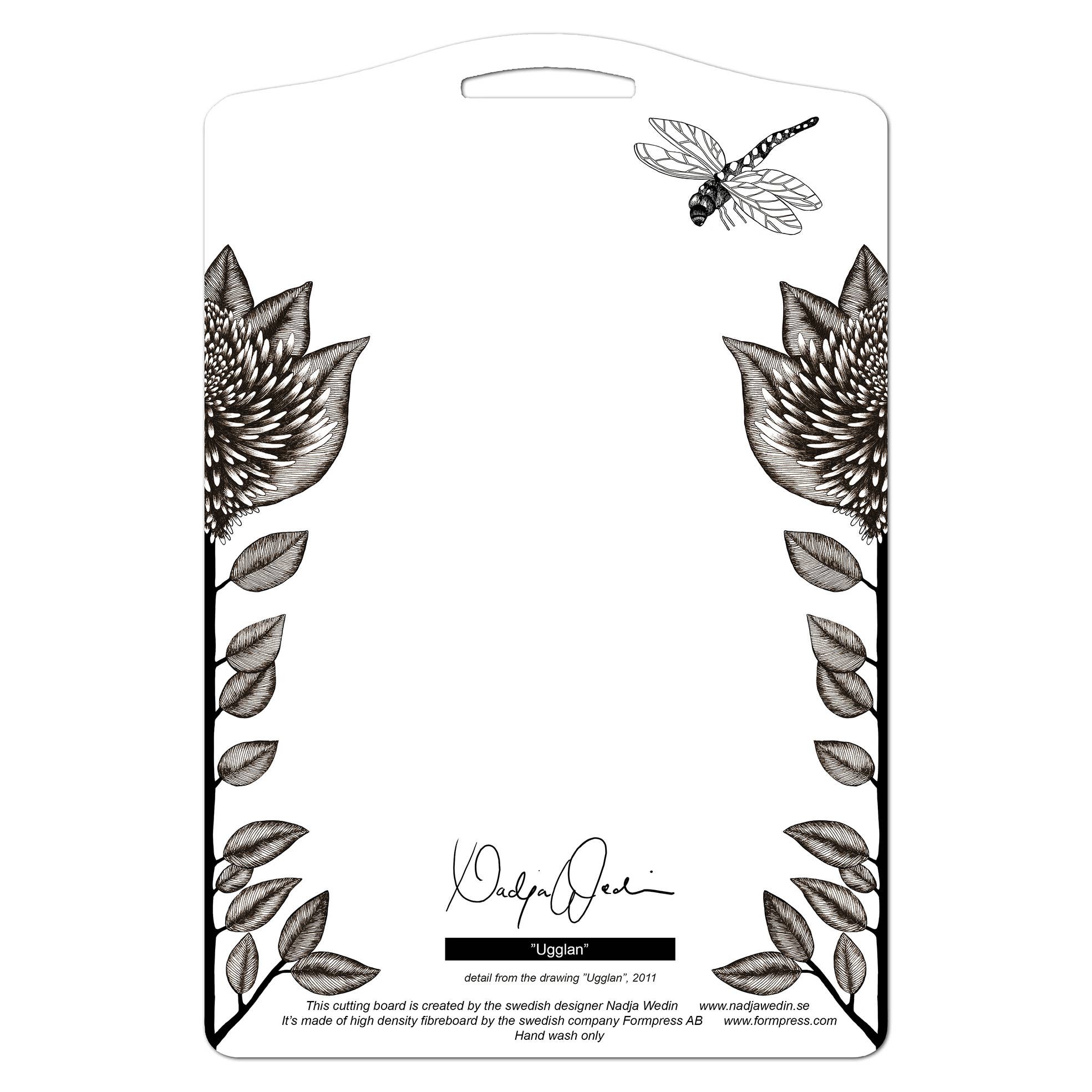 The product is a serving board titled "The Owl," measuring 8x12 inches (20x30 cm), adorned with black floral designs and a dragonfly, and featuring the signature of Swedish artist Nadja Wedin. Care instructions are included.