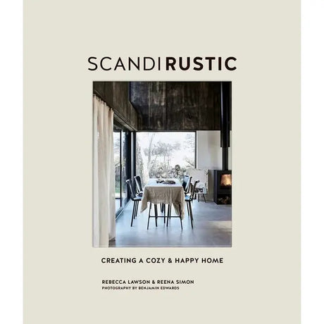 Cover of Scandi Rustic: Creating a Cozy & Happy Home by Rebecca Lawson & Reena Simon features a rustic Scandinavian dining space with large windows and neutral tones. Photography by Benjamin Edwards.