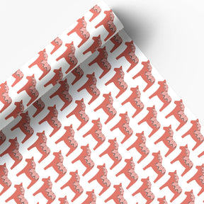 Juniper Blue's Swedish Dala Horse Gift Wrap features a glossy sheet with a Nordic pattern of red Dala horses with white floral accents on a white background. Two 20" x 29" sheets are partially rolled to reveal the charming design.