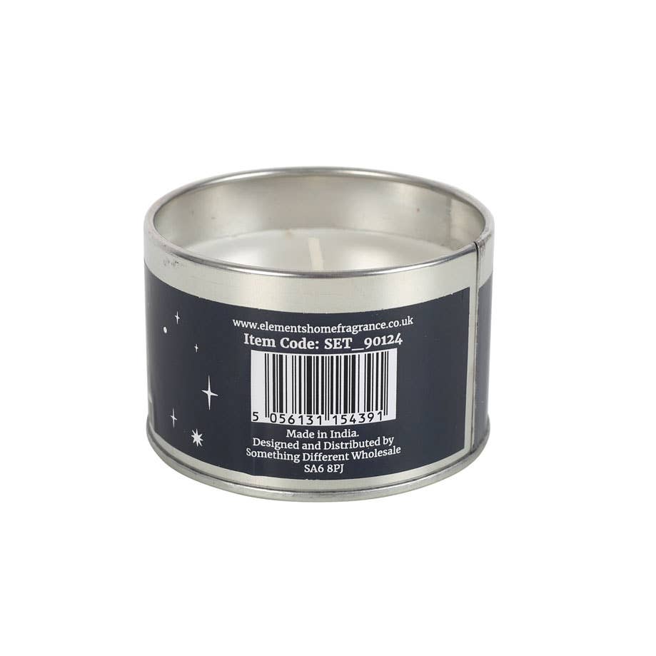 A round tin candle from the Gnome Sweet Gnome Candles in Display collection, adorned with a navy label featuring enchanting stars, barcode, and product details. Its winter forest design adds charm to any space and showcases item code, manufacturer, and distributor information.