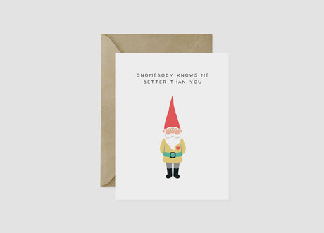 Card: "Gnomebody Knows Me Better Than You"—a Scandinavian-inspired greeting card featuring a whimsical gnome illustration, paired with a brown envelope. Perfect for Valentine’s Day!.