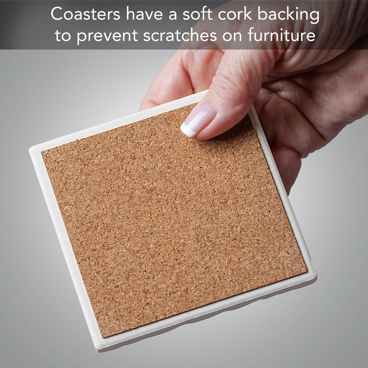 A hand holds a tile coaster with cork backing. Text above reads: The Spring Gnomes Tumbled Tile Coaster 4 Pack features a soft cork back to prevent furniture scratches.