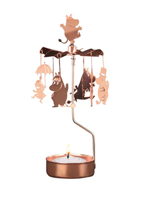 The Candle Holder: Moomin Family Rose Color Pluto Design is a rotary candle holder featuring Moomin characters that gently spin above a Christmas tea light, casting whimsical shadows as it rotates.