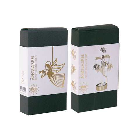 Two green boxes labeled Änglaspel with a gold angel design. One box features the Pluto Design Gold Flying Angels Rotary Candle Holder.