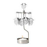 The Candle Holder: Love Birds Pluto Design Bird Heart "Love Birds" is a metal rotary candle holder with a carousel featuring bird heart ornaments, perfect for displaying your favorite tea light.