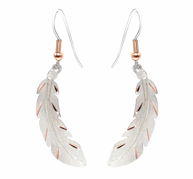The Copper Feather Silver Plated Textured Earrings feature a metallic finish, hook fastenings, and gold accents—perfect handmade earrings to add a unique touch to any look.