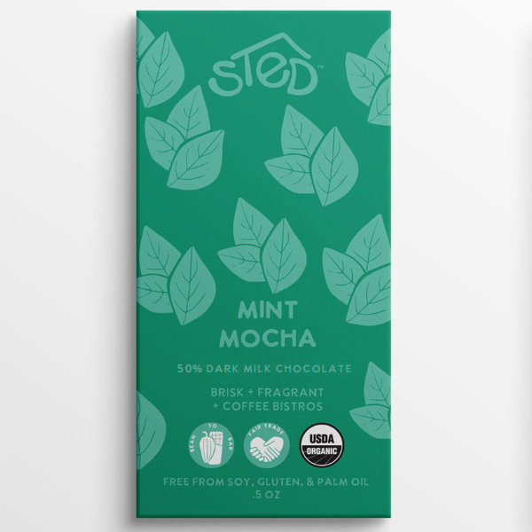 Chocolate bar in a green wrapper with leaf art, labeled “STED Mint Mocha 50% Dark Milk Chocolate,” and showing USDA Organic certification.