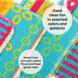 Close-up of vibrant, patterned Skoy Scrub Cloths by Skoy Enterprises with visible stitching. Text: Good clean fun—eco-friendly kitchen scrubbers made from remnant cotton fibers and food-grade resin.