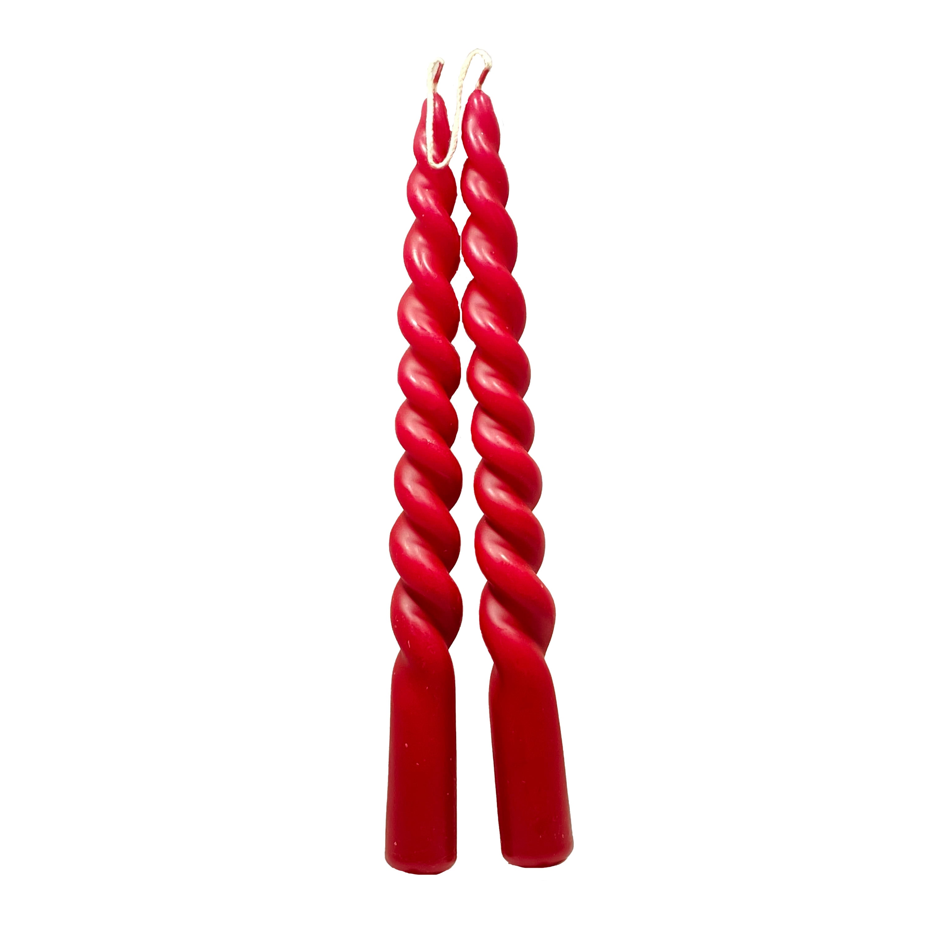 A pair of Denmark Wine Red Twisted Taper Candles stands upright on a white background, highlighting the exquisite craftsmanship inspired by Danish traditions.