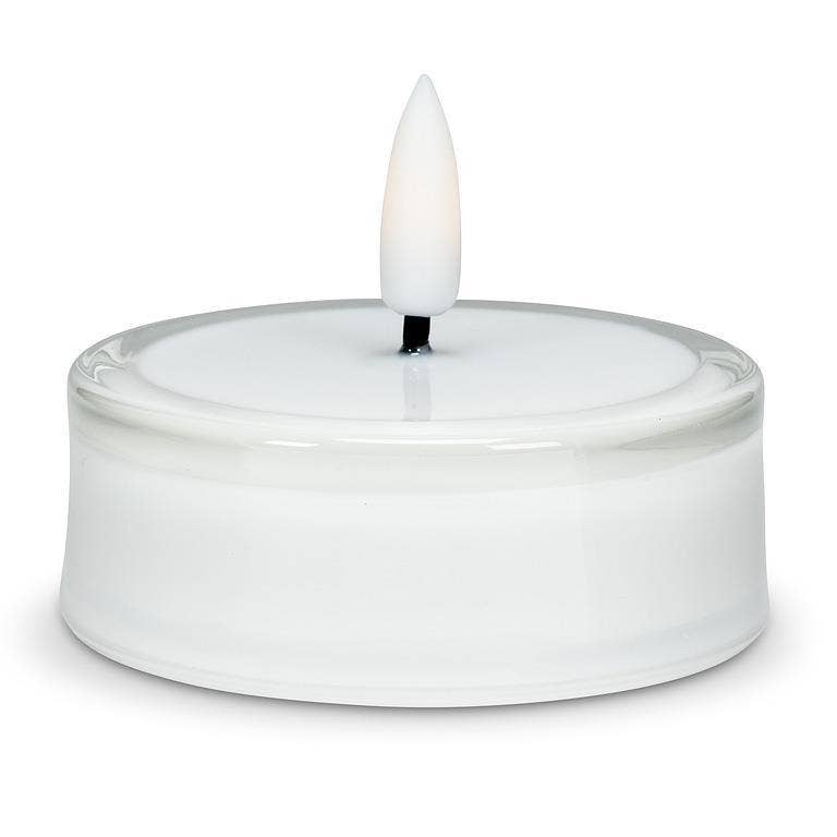 LED tea light candle with a clear glass rim and a flickering flame.