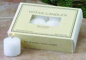 A box of twelve 10-hour white votive candles with a single lit candle in the foreground.