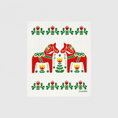 Swedish dishcloth with two red Dala horses surrounded by floral folk art patterns in red, green, and yellow.