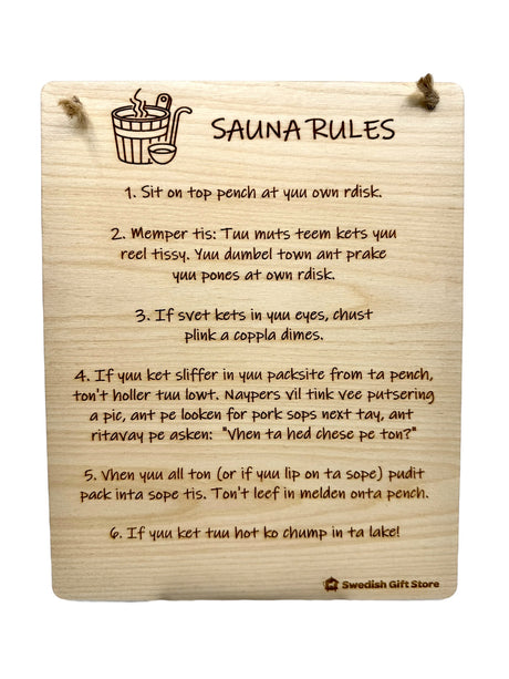 Novelty Signs: Sauna Rules – A wooden sign with funny, phonetically spelled sauna instructions and safety tips, hangs by two strings at the top.