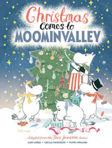 Picture book cover showing four cartoon Moomin characters decorating an outdoor Christmas tree at night under a starry sky, with the title text above.