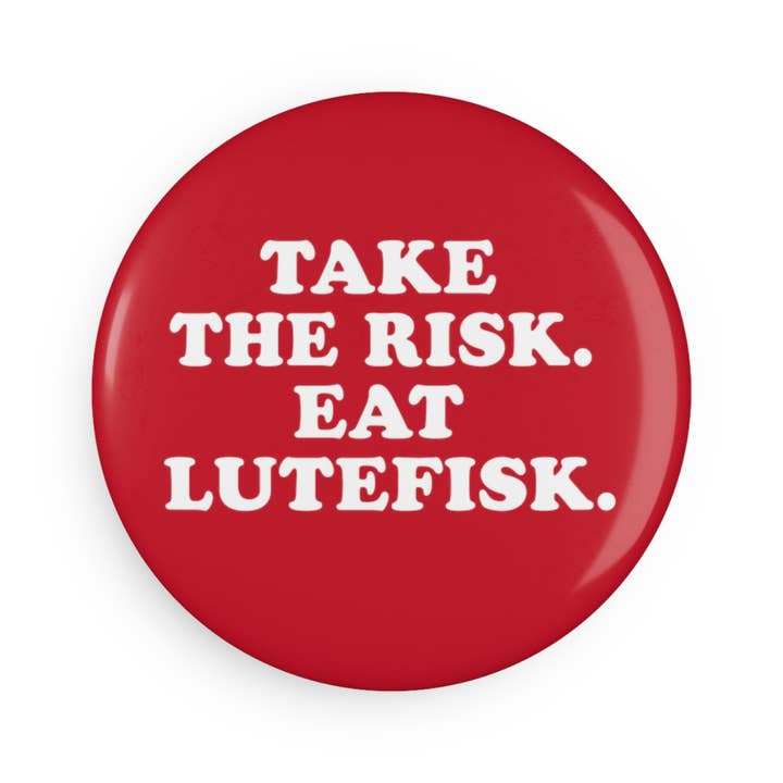 2.25" round magnet with a bold red button design, featuring the phrase "Take the Risk, Eat Lutefisk" in crisp white letters.