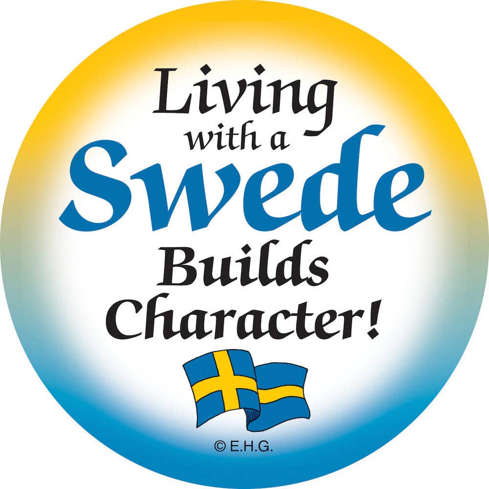 The "Living with a Swede Builds Character!" round refrigerator magnet showcases the phrase stylishly, complete with two small Swedish flags beneath.