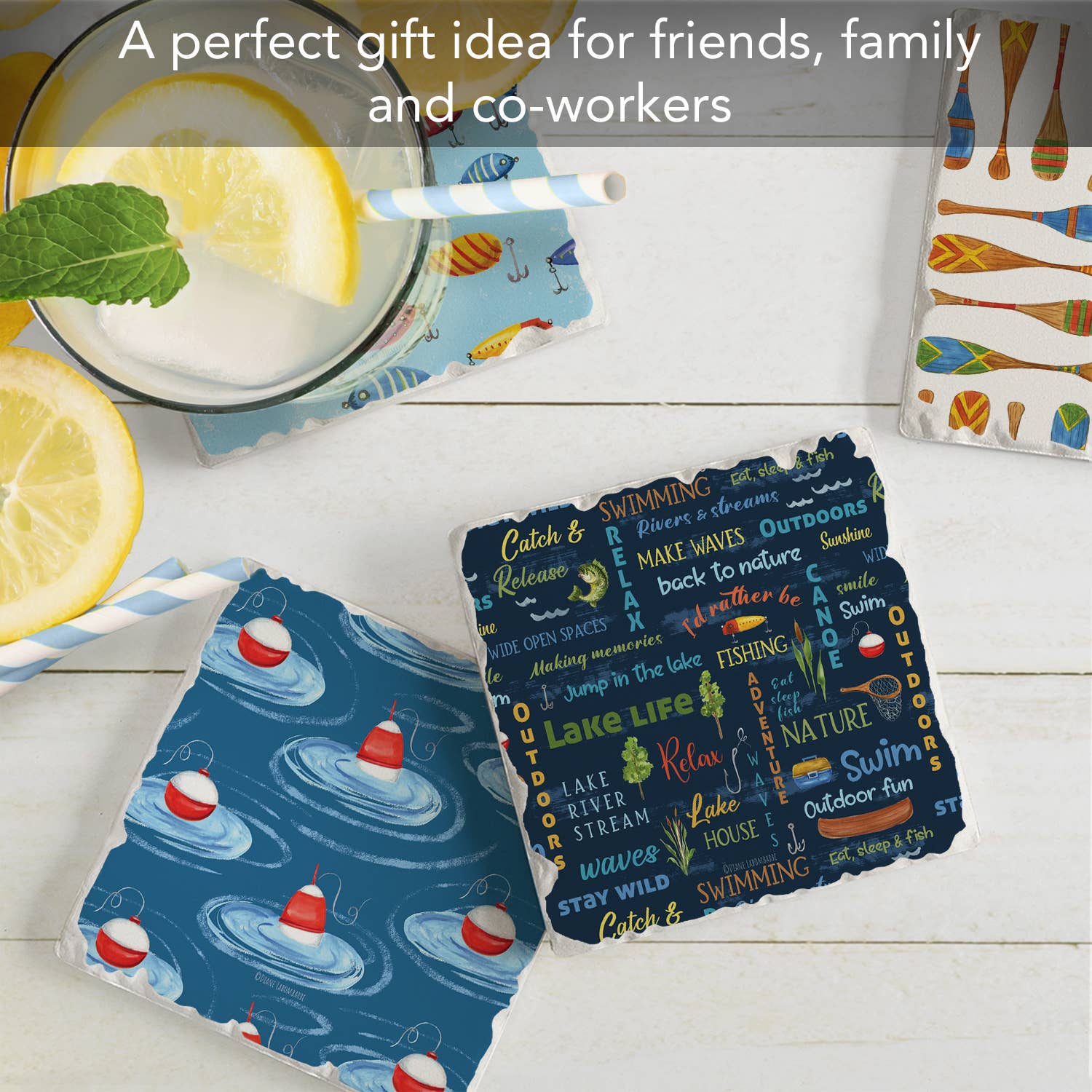 The Lake Living Coaster #3 set includes four vibrant coasters adorned with water and summer-themed designs, each with a cork backing for stability and an absorbent stone surface. They are ideal for holding a glass of lemonade and preventing condensation rings during cozy gatherings.