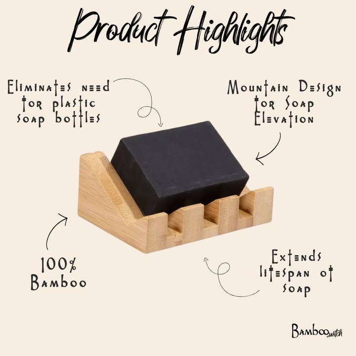 Black bar of soap on a slatted bamboo soap holder with raised edges.