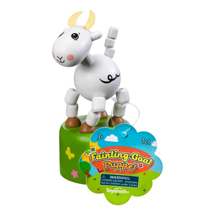 The Farm Fresh Fainting Goat Puppet - Retro Toys stands on a green base with a product tag, offering farm-fresh fun and nostalgic charm to any playroom.