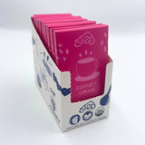 A display box with several pink-wrapped chocolate bars labeled Sted Ethiopian coffee, featuring a coffee cup illustration on each wrapper.