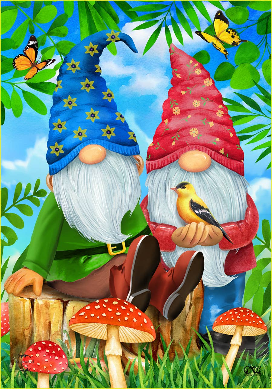 The "Gnome Sweet Gnome" garden flag showcases two gnomes, one with a red hat and the other with a blue hat, seated on a tree stump amidst mushrooms while holding a small yellow bird. Butterflies flutter around them, and lush green foliage frames them against a serene blue sky background. Crafted from durable burlap material, this flag is ideal for adding charm to your outdoor display.