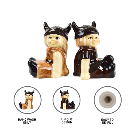 The Shakers: Viking Couple Vintage Salt & Pepper Shakers (3" tall) feature a male and female Viking back-to-back. Hand wash only, uniquely designed, and easy to refill—ideal for Scandinavian kitchen decor.