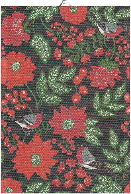 The "JULFÅGLAR" woven tea towel by Ekelund features red flowers, green leaves, berries, and birds on black organic cotton—ideal for Scandinavian kitchen decor.