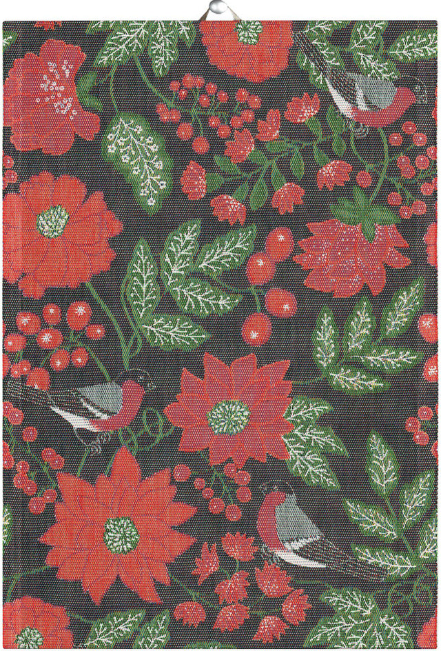 The "JULFÅGLAR" woven tea towel by Ekelund features red flowers, green leaves, berries, and birds on black organic cotton—ideal for Scandinavian kitchen decor.