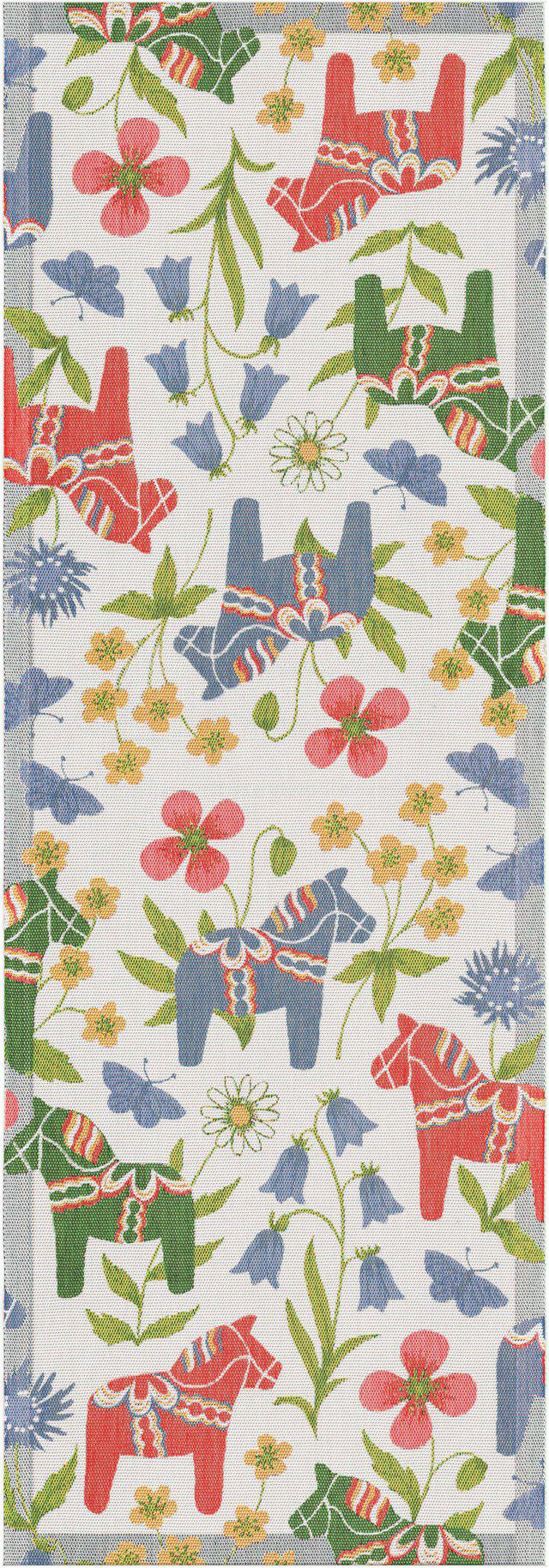 The "Blomsterhast" Flower Horse Table Runner by Ekelund is a rectangular organic cotton runner with red and blue Swedish Dala horses, green leaves, and colorful flowers on a white background.