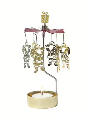 Gold-tone metal rotary candle holder with hanging Santa Claus figures and a gift topper, designed to spin above a tealight candle.