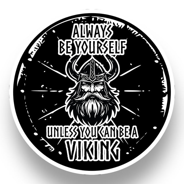 A black and white circular illustration features a bearded Viking helmet, radiating Nordic warrior energy. Text reads: Always be yourself unless you can be a Viking. This Nordic Sticker: Viking Shield is 4x4 inches, glossy, UV & water-resistant, dishwasher safe, easy peel. Buy 3 Get 1 Free.