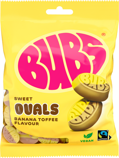 A 90g bag of Faire - Stock Boy Candy: Bubs Foam Banana Toffee Ovals vegan gummy candy. The yellow and pink packaging features oval banana toffees and displays vegan and Fairtrade logos in the bottom right corner.