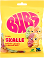 A yellow 90g bag of Faire - Sweet as Fudge Candy: Bubs Sour Foam Fruity Lemon Skulls shows three cartoon lemon skull gummies, vegan and Fairtrade logos, pink BUBS branding, and Scandinavian candy pieces visible through the packaging.