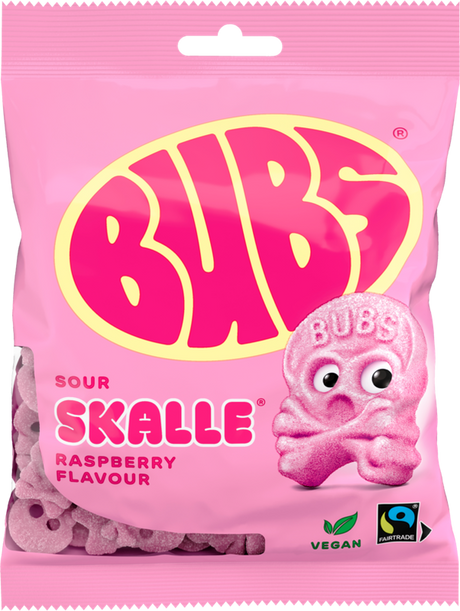 A 90g bag of Faire - Sweet as Fudge Candy: Bubs Sour Foam Raspberry Skulls, a vegan gummy with raspberry flavor. The pink pack features Fairtrade and vegan symbols and a large yellow-pink Bubs logo with a pink skull candy illustration.