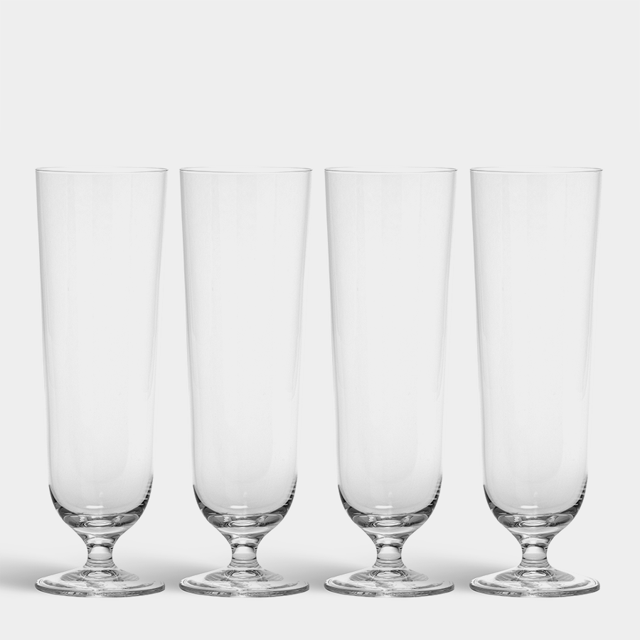 Four empty Orrefors Beer Pils 15.5oz glasses (4-Pack by Erika Lagerbielke) are lined up side by side on a white background.