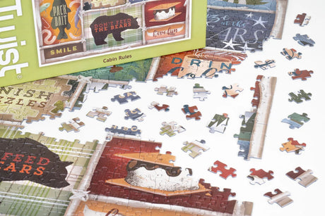 Partially assembled jigsaw puzzle with colorful pieces. Puzzle box displays bear artwork, “Don’t Feed the Bears” text, and cabin-themed graphics.