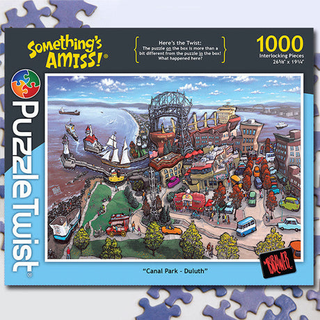 PuzzleTwist: Canal Park - Duluth (1,000 Pieces) offers a lively jigsaw puzzle featuring charming illustrations of boats, buildings, and roads in Canal Park.