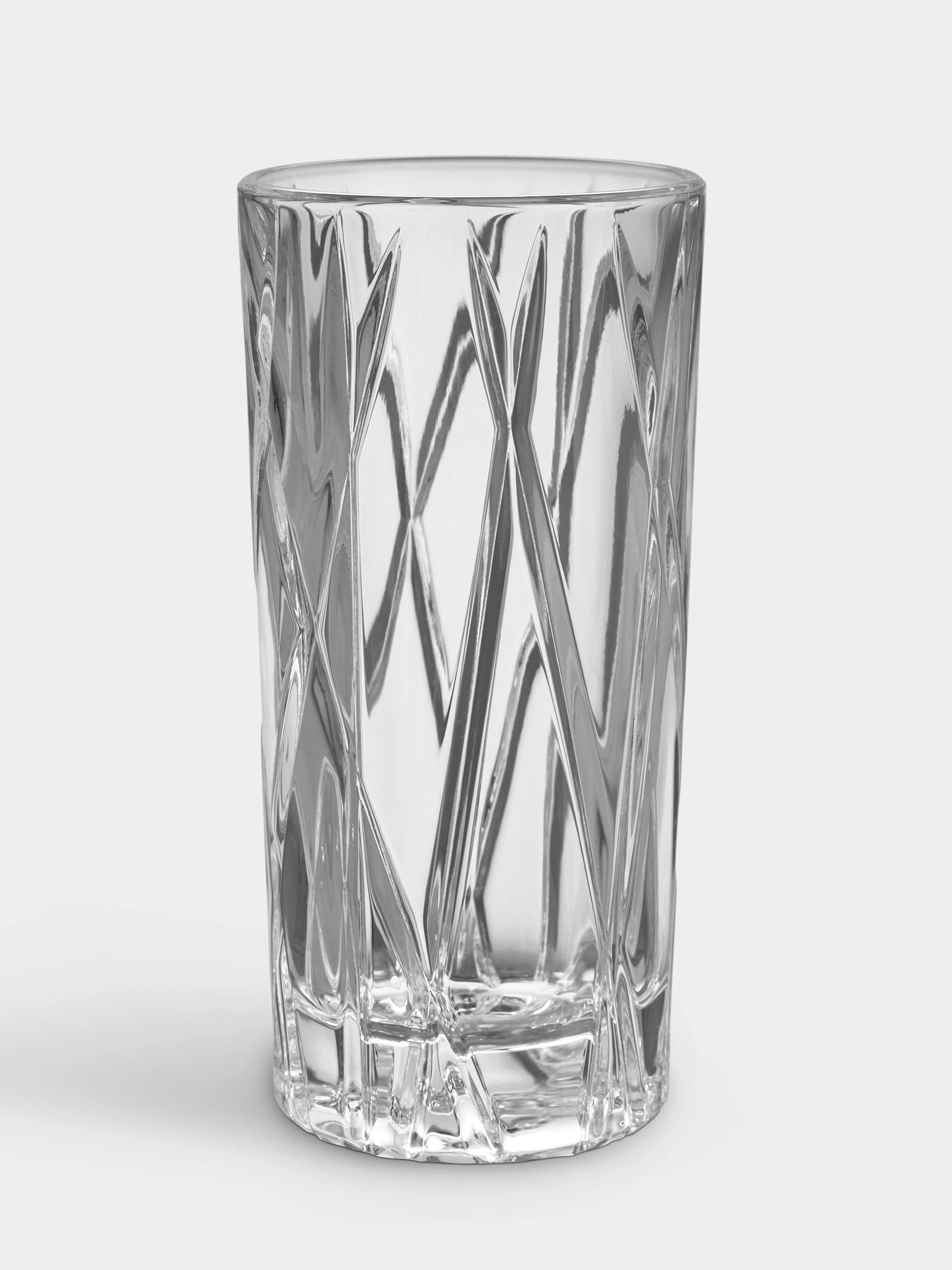 An empty Orrefors City Shot Glass (1.7oz, 2-Pack) with a diamond-patterned texture on its crystal surface, displayed against a plain background.