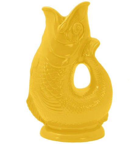 The Gluggle Jug: Gluggle Jug Classic Made in Europe is a yellow ceramic, fish-shaped British pitcher with a curved tail handle and open mouth.