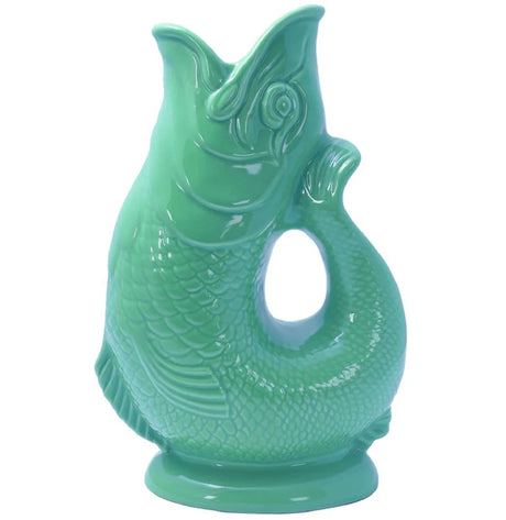 The Gluggle Jug: Gluggle Jug Classic Made in Europe is a green ceramic fish-shaped jug with textured scales, a curved body, and an open mouth at the top—an iconic piece of British tableware.