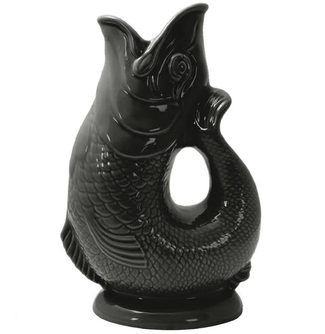 The Gluggle Jug Classic Made in Europe is a glossy black ceramic fish-shaped jug, with an open mouth and its tail forming the curved handle—a timeless British tableware icon.