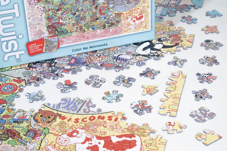 Colorful jigsaw puzzle pieces scattered next to a partially assembled Minnesota-themed puzzle and a box labeled “Color Me Minnesota” with illustrated graphics.